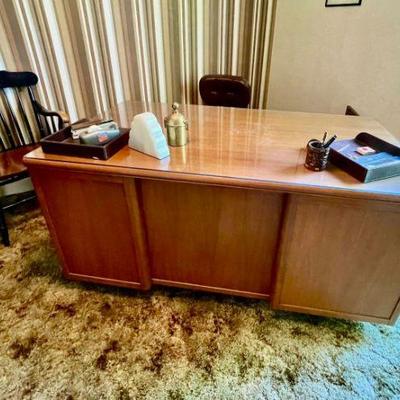 Lot 012-OFC: Desk Vignette

Features: 
â€¢	Mid-century executive desk, 1 mid-century office swivel chair, 1 wooden chair, and 1 Smith...