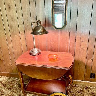 Lot 013-DEN: MC Tea Serving Cart Vignette

Features: 
â€¢	Mid-century rolling wooden serving cart, lamp, wall mirror, and vintage orange...