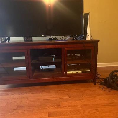 Dark wood tv stand holds up to 80 inch tv 350.00