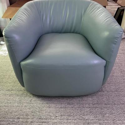 Pair of light green swivel lounge chairs 