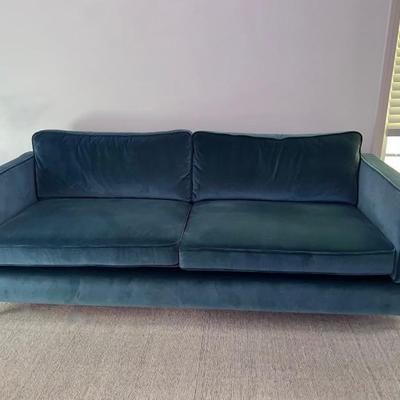 A velvet material MCM sofa in teal