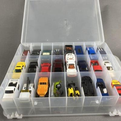 Lot 125 | 48 Hot Wheels/ Matchbox Cars With Case