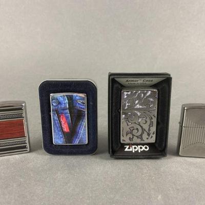 Lot 518 | 4 Zippo Lighters
