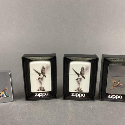 Lot 537 | Flame Art Bird Zippo Lighters & More