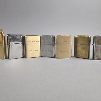 Lot 564 | Engraved Zippo Lighters & More!