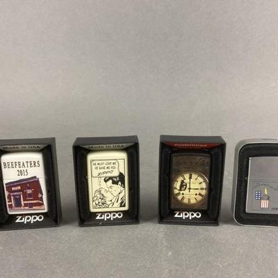 Lot 494 | Beefeater's 2015 Zippo Lighter & More