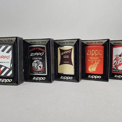 Lot 447 | Zippo Graphic Windproof Lighters