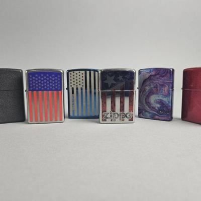 Lot 567 | Zippo Flag Graphic Lighters & More!