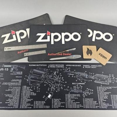 Lot 591 | Zippo Mats, Accessories & More!