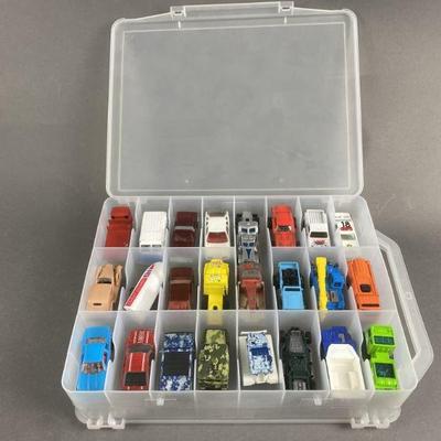 Lot 129 | 48 Hot Wheels/ Matchbox Cars With Case