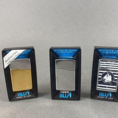 Lot 542 | 18k Gold Plated Zippo BLU & More