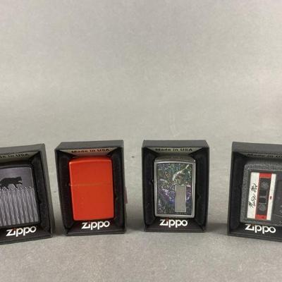 Lot 403 | Cat On a Fence, Mix Tape Zippo's & More