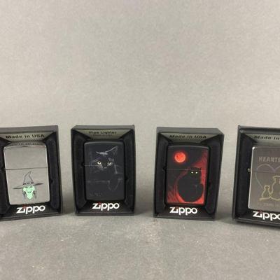 Lot 532 | Black Cat Zippo Lighters & More