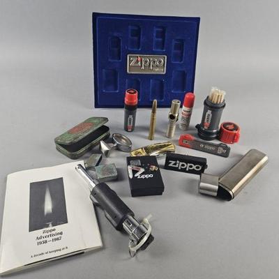 Lot 606 | Zippo Fire Kits & Contents On Table