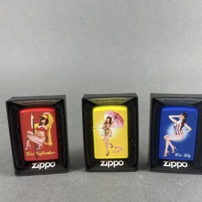 Lot 474 | 3 Zippo Pin Up Girl Lighters