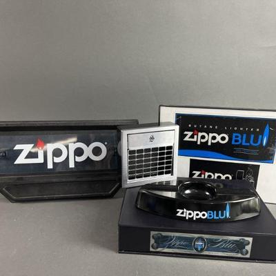 Lot 587 | Zippo, Blu, Display Items