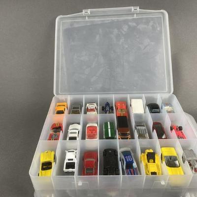 Lot 124 | 48 Hot Wheels/ Matchbox Cars With Case