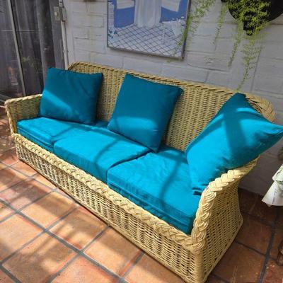 Yellow wicker Sofa, well loved but solid. $125.  $100 for the cushions.  obo