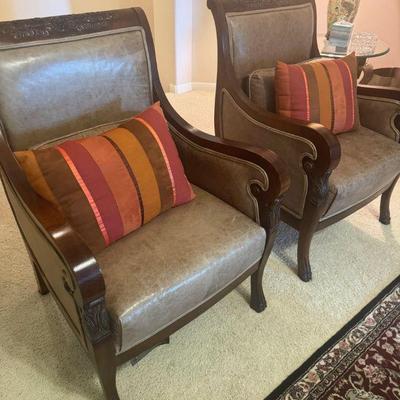 pair of leather arm chairs
