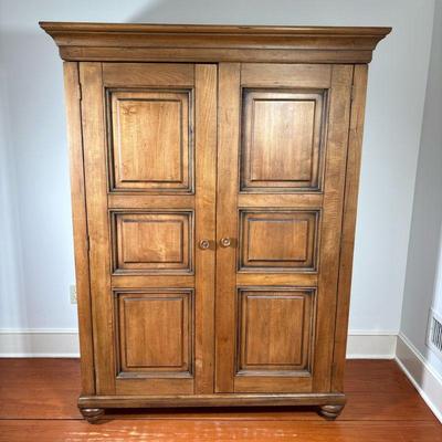 WOODEN COMPUTER CABINET | Armoire console with two wood paneled doors, featuring double hinges. On turned feet. - l. 51 x w. 22.4 x h....