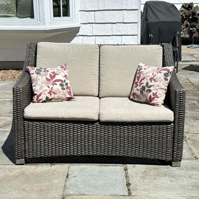 PATIO SOFA | Dark brown wicker patio 2-seat patio sofa. Beige cushions. - l. 53 x w. 28 x h. 35.5 in


