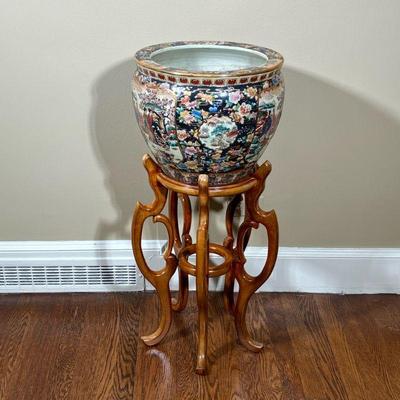 CHINESE JEWELED ENAMELED FISH BOWL JARDINIERE | On a tall conforming stand, marked made in China stands at 24 inches - h. 12 x dia. 16 in...