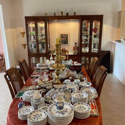 Dining room is full of china and serviing ware. 