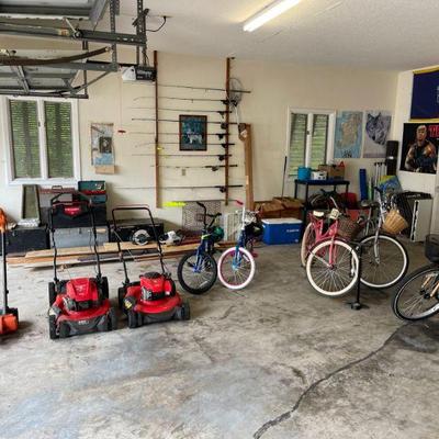 Outdoor lawn equipment - bicycles and some tools. 
