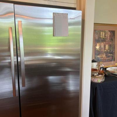 Whirlpool full size freezerless refrigerator only on right.  Full size freezer on left NOT for sale