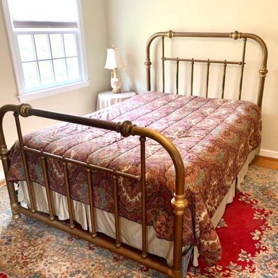 Antique brass bed with Queen-sized bedding