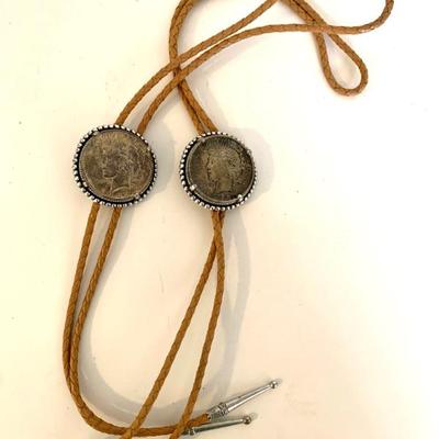2 bolo ties with silver dollars