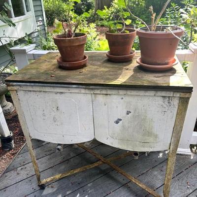 Potted plants & vintage pottery table