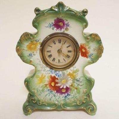1005	ANTIQUE MINIATURE GERMAN CHINA DRESSER CLOCK, APPROXIMATELY 3 IN X 5 IN X 7 1/4 IN
