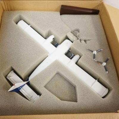 1284	SCALE MODEL OF AN AIRPLANE W/STAND & BOX, PLANE APPROXIMATELY 13 IN LONG
