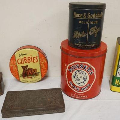 1073	GROUP OF ASSORTED ANTIQUE TINS INCLUDING TETLEY TEA, MUSSER'S POTATO CHIPS, NY MAPLE SYRUP, ETC, LARGEST APPROXIMATELY 10 IN HIGH
