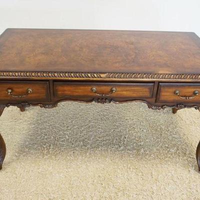 1221	SEVEN SEAS HOOKER LIBRARY DESK HAVING 3 DRAWERS & CARVED CABRIOLE LEGS, TOP HAS SURFACE WEAR, APPROXIMATELY 60 IN X 30 IN X 32 IN HIGH

