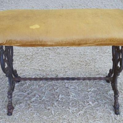 1240	VICTORIAN UPHOLSTERED BENCH ON ORNATE IRON BASE, APPROXIMATELY 27 IN X 12 IN X 18 IN
