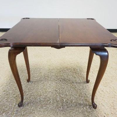 1220	MAHOGANY QUEEN ANNE STYLE CARD TABLE W/CABRIOLE LEGS & APPLIED SHELL CARVING, APPROXIMATELY 34 IN X 17 IN X 31 IN CLOSED, OPEN 34 IN
