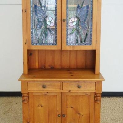 1251	PINE 2 PART CABINET WITH BUTTERFLY AND FLOWER STAIN GLASS DOORS, APPROXIMATELY 41 IN X 21 IN X 79 IN H
