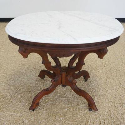 1242	VICTORIAN OVAL MARBLE TOP TABLE MISSING CENTER FINIAL, APPROXIMATELY 32 IN X 23 IN X 30 IN HIGH
