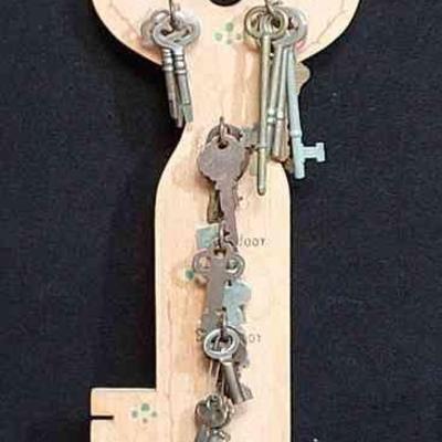 Antique Key Collection On Wooden Key Rack
