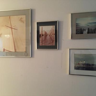 Framed photographs, nautical & shore images of varying sizes