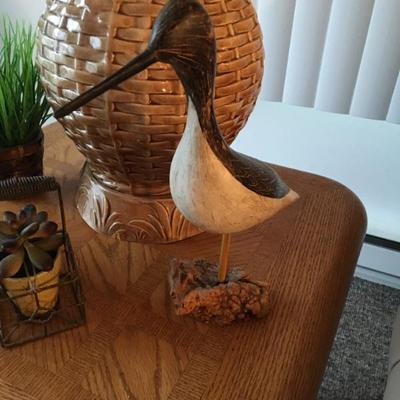 Carved & painted seabird, signed by artist, set onto a burled wood base