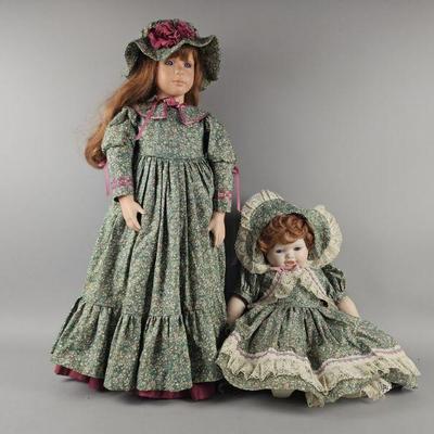 Lot 141 | Two Matching Porcelain Doll & Baby