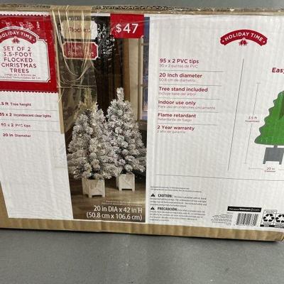 Lot 426 | Set of 2 3.5 feet flocked Christmas trees