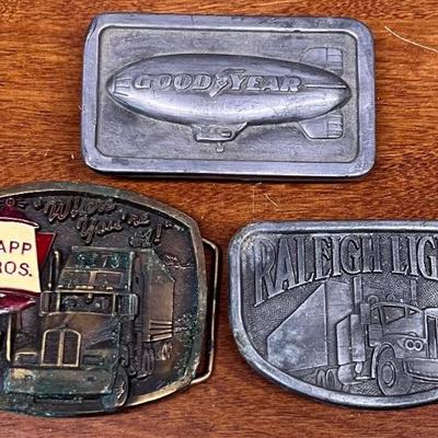 (3) Brass & Pewter Belt Buckles - Good Year 1974, Sapp Bros 1989, & Raleigh Lights 