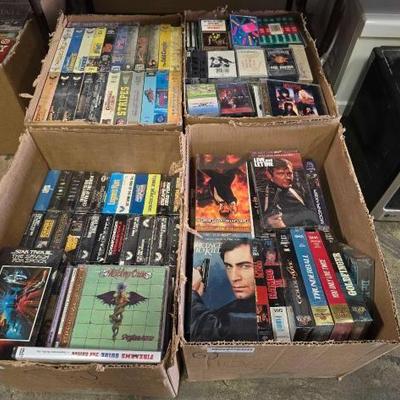 #1106 • 4 Boxes of VHS Cassette Tapes and CDs
