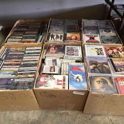 #1104 • 6 Boxes of CDS and Cassette Tapes
