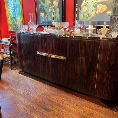 1920s Art Deco macasser ebony sideboard with brass mounts and a marble top, French