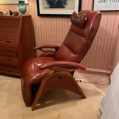 Andrew LeBlanc brown leather and wood recliner, very modern and elegant, sleek design, not  so bulky